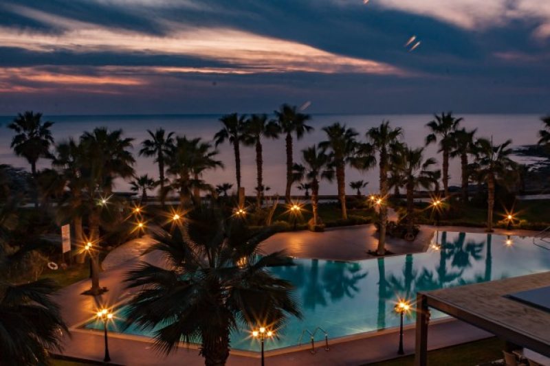 hotel-pool-lit-up-at-sunset-cyprus-greece_t20_P1eVmd.jpg